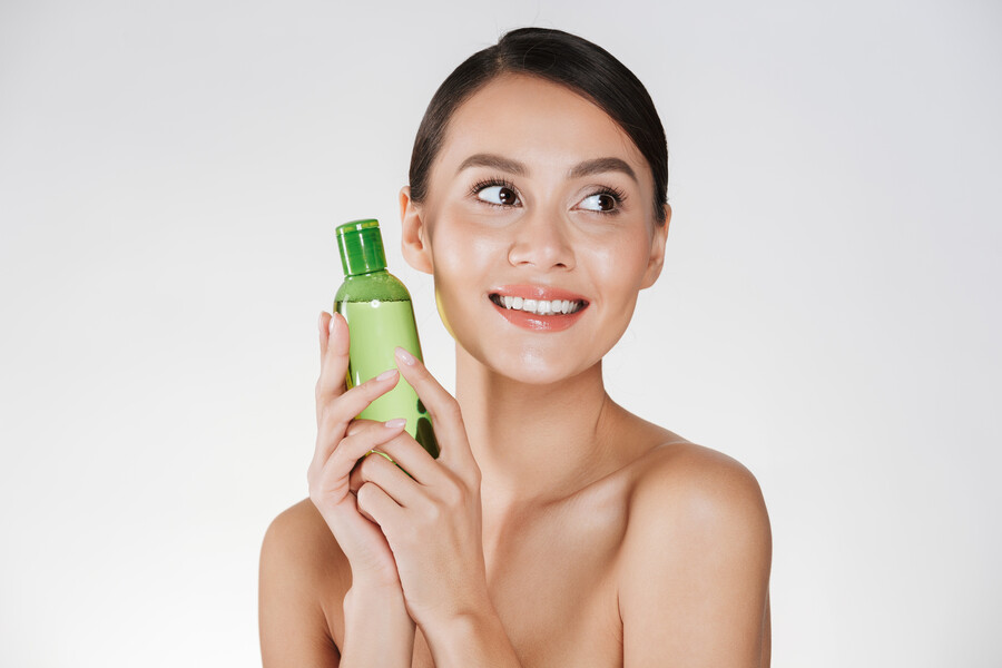 beauty-portrait-pleased-dark-haired-woman-with-clean-healthy-skin-holding-lotion-removing-makeup-looking-aside-isolated-white_ca03f.jpg