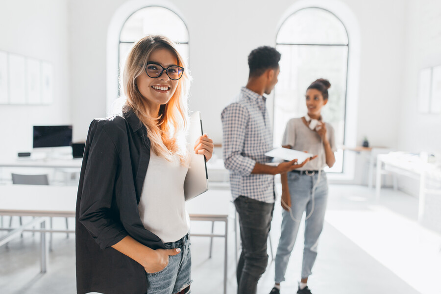 elegant-business-lady-trendy-black-jacket-holding-laptop-smiling-portrait-cheerful-blonde-secretary-tall-african-office-worker_4fe5f.jpg