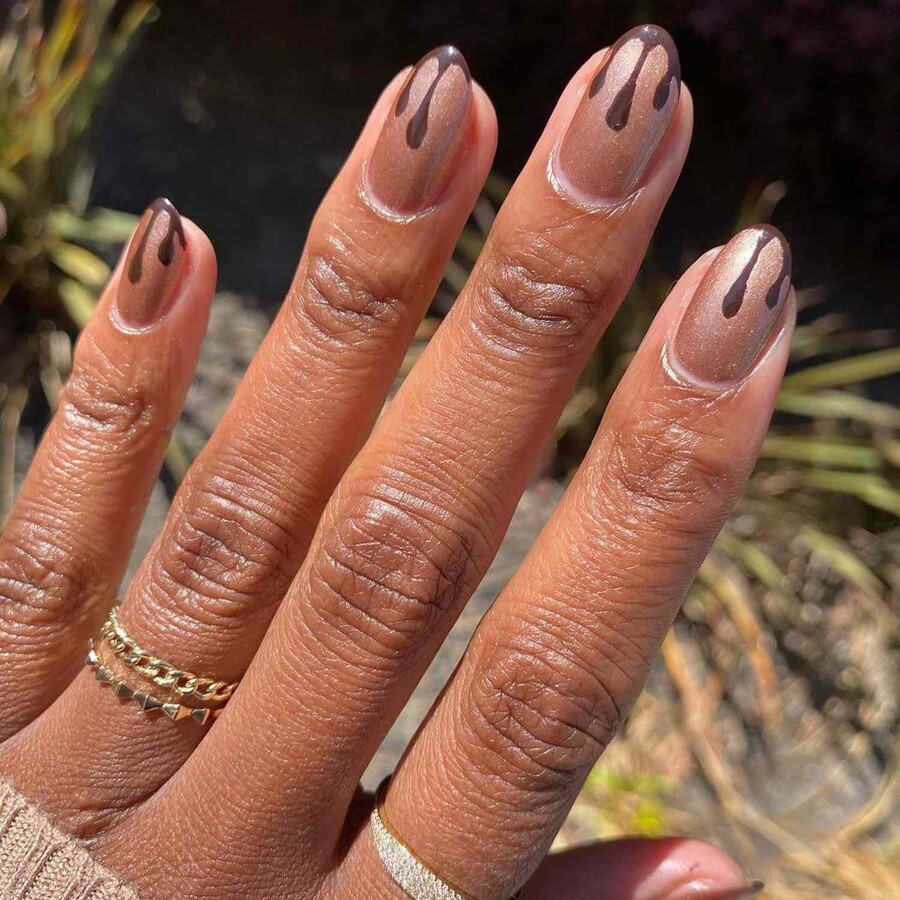 Champagne-Shimmer-Chocolate-Drip-French-Tips-Byrdie-Chocolate-Nails-32b76f0423ae42428afc23d854c4287d_17577.jpg