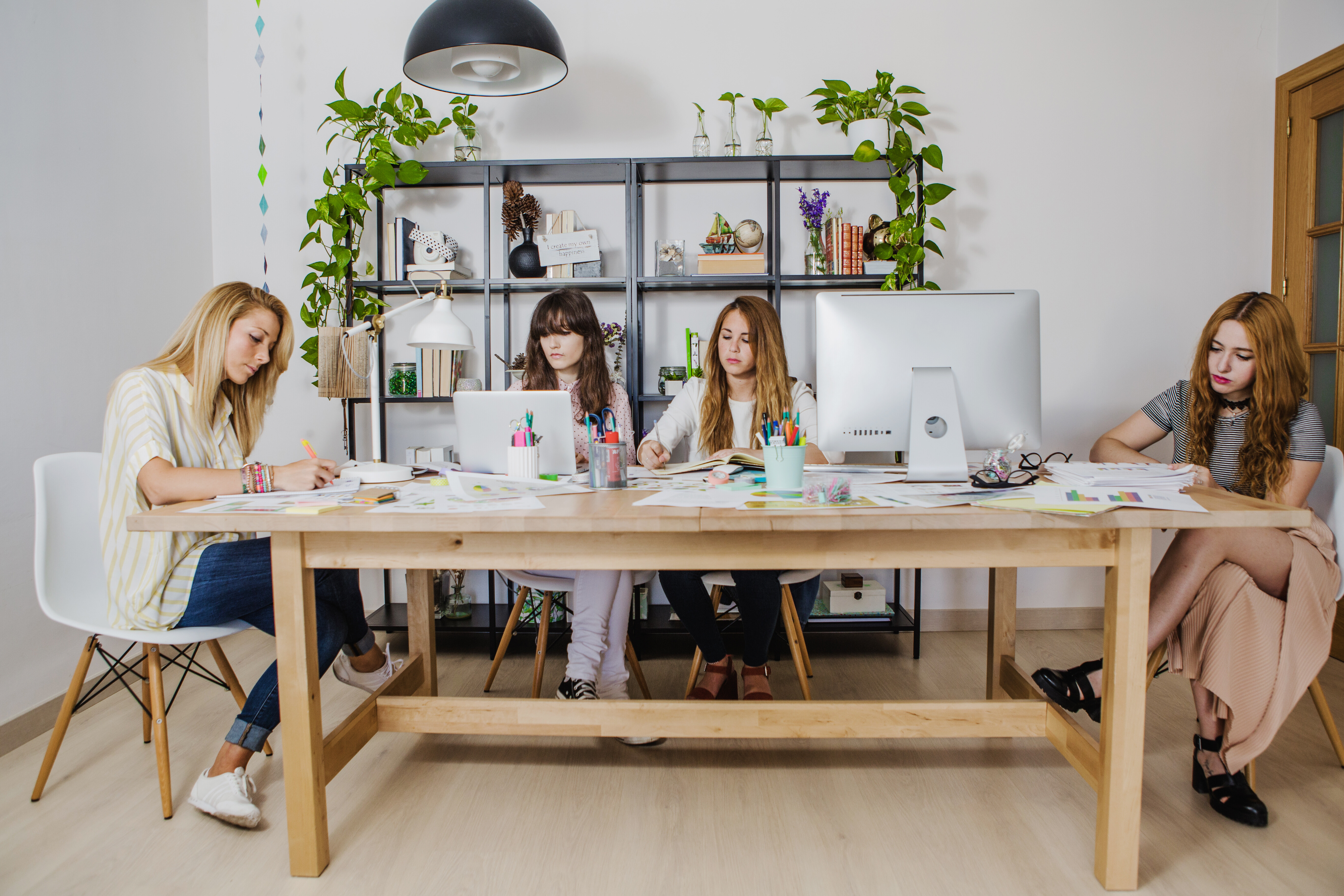 young women gathering table creating 40261
