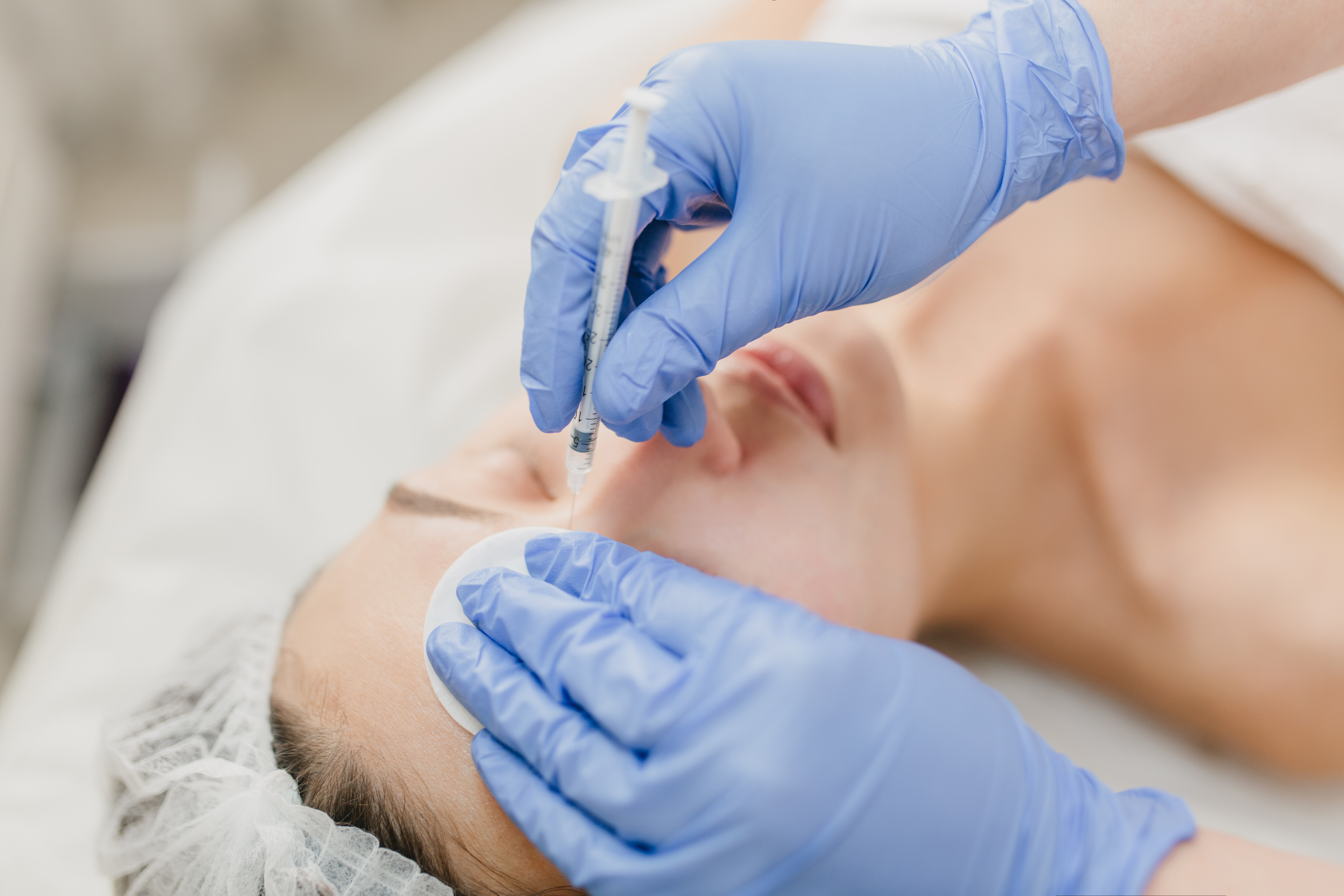 hands blue glows cosmetologist work with pretty woman injection face rejuvenation professional healthcare medicine medical therapy skincare botox e9bda