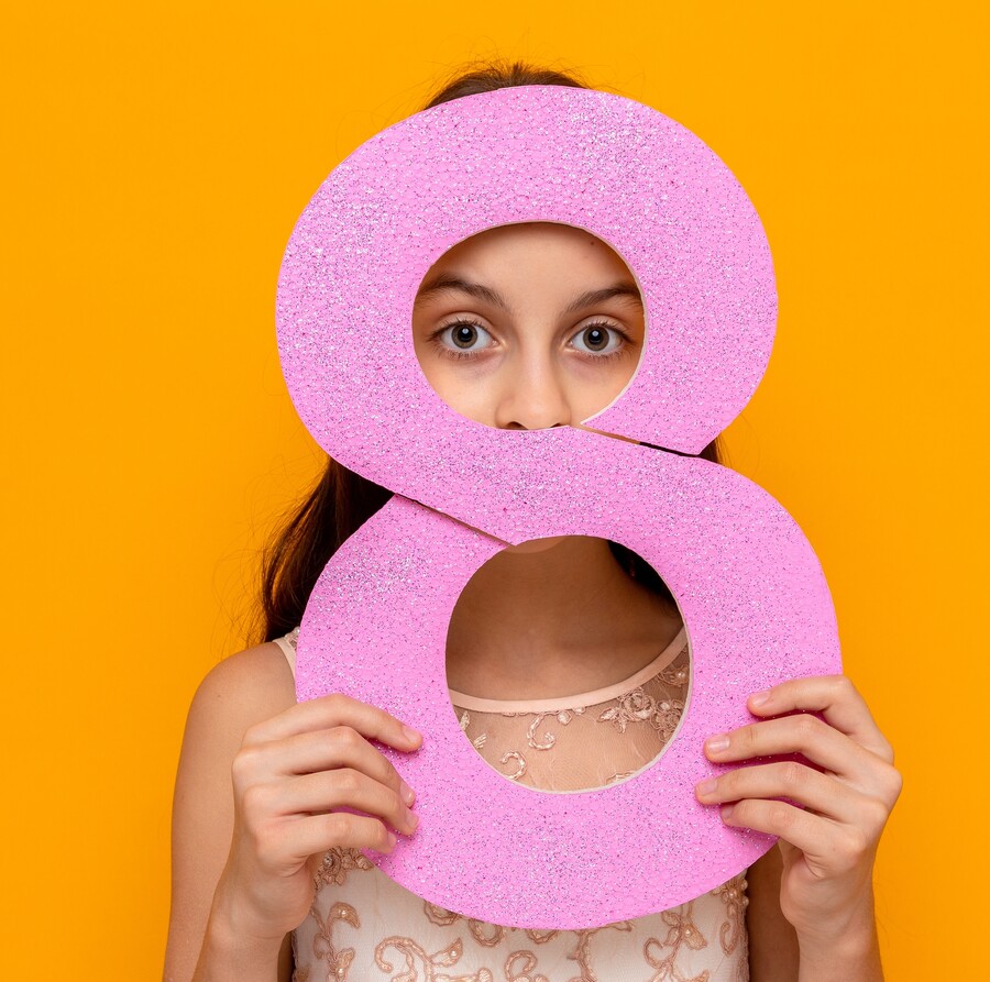 beautiful-little-girl-happy-women-s-day-holding-covered-face-with-number-eight_f8dd4.jpg