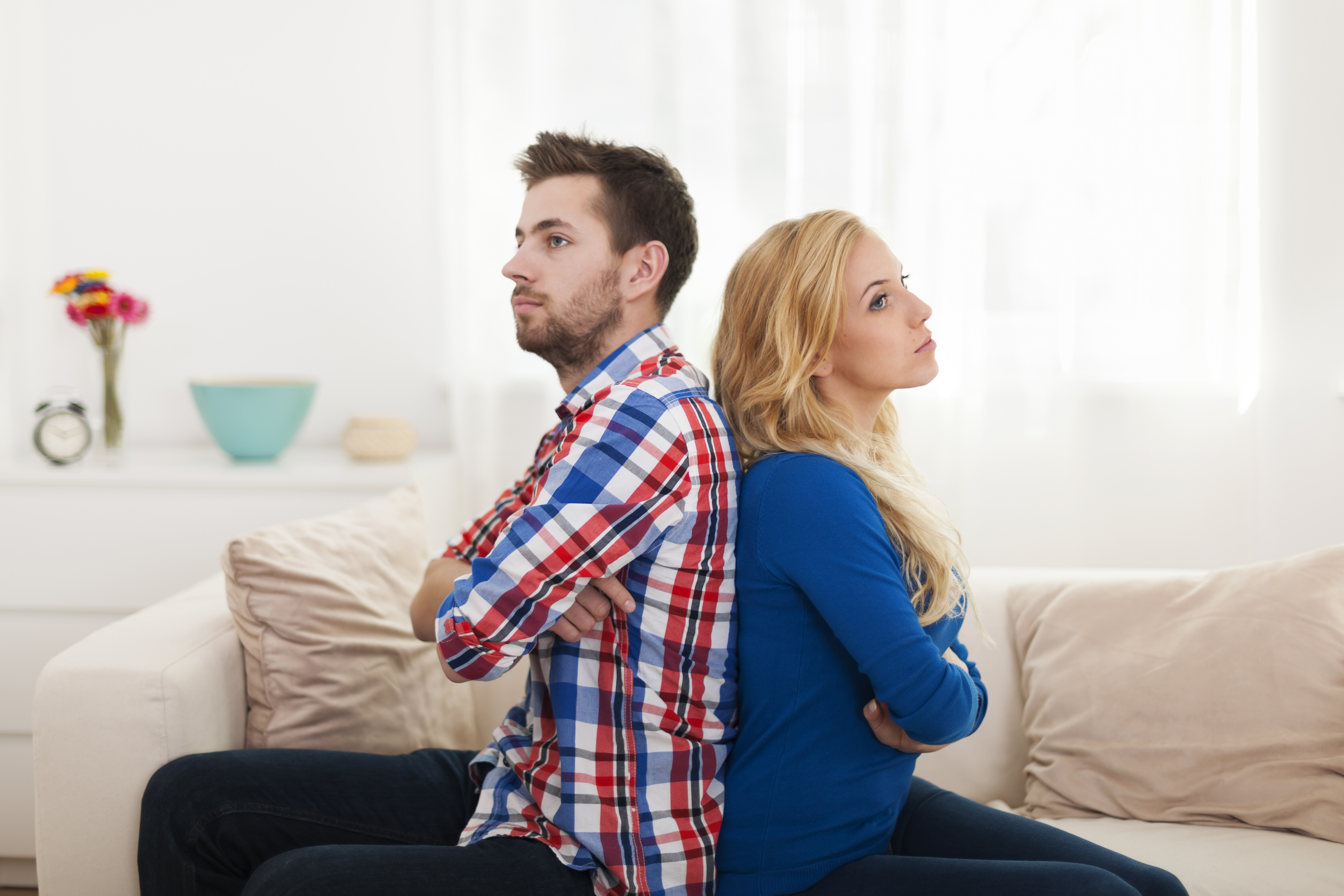 angry young couple sitting back back home 965fc