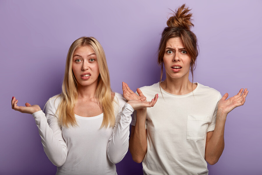 brunette-blonde-women-make-confused-uncertain-gesture-shrug-shoulders-should-decide-something-important-wear-casual-white-clothes-isolated-purple-wall-apathy-decision_de5b2.jpg