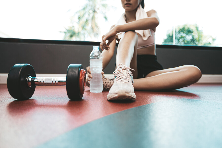 women-sit-back-relax-after-exercise-there-is-water-bottle-dumbbells_b5996.jpg