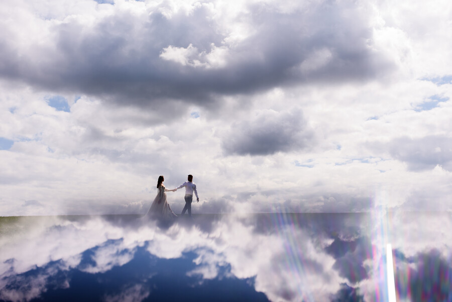 view-from-distance-newlyweds-walk-clouds_3fe02.jpg
