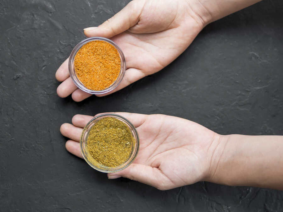 top-view-hands-holding-bowls-full-spices_a51f9.jpg