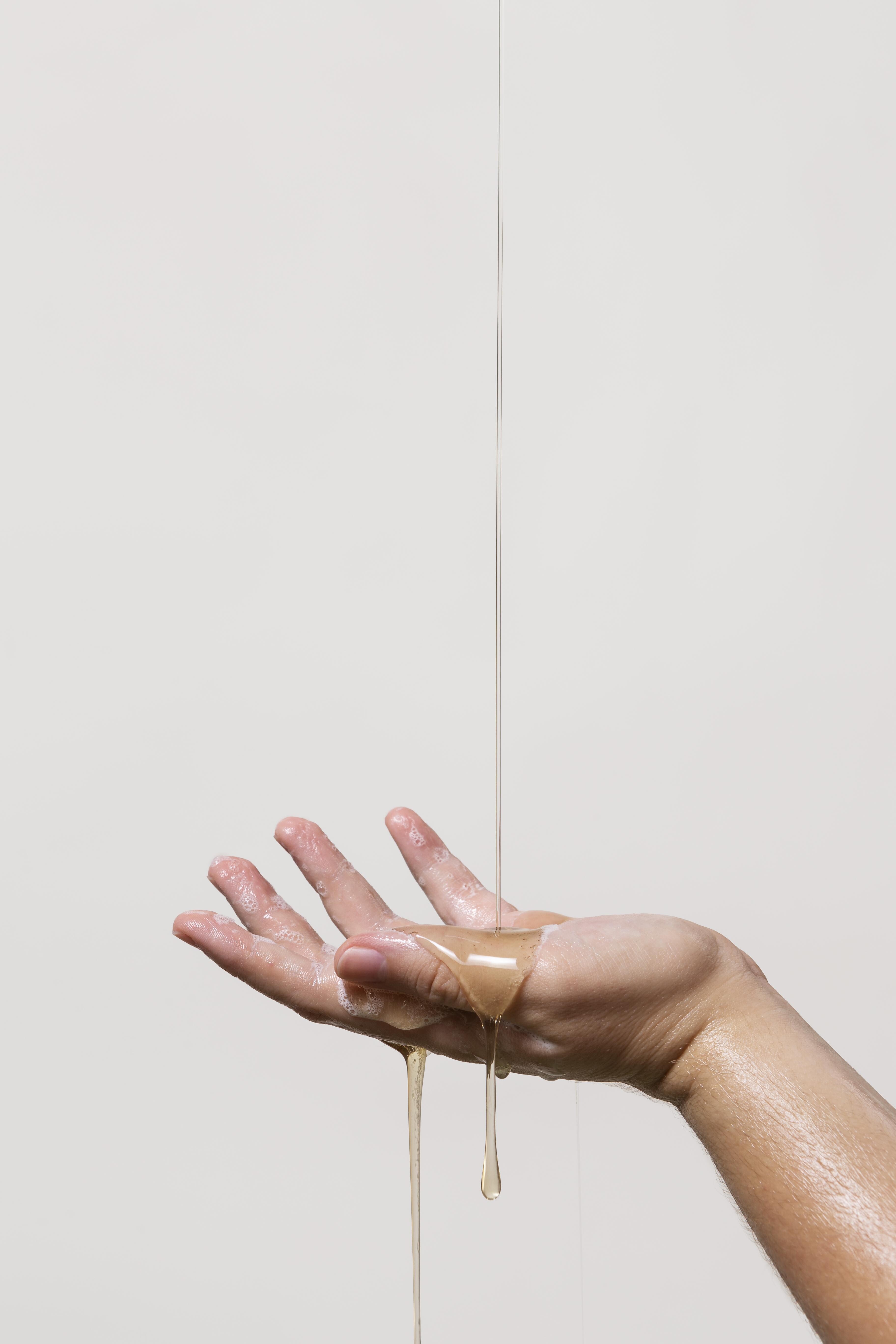 person washing hands with soap 73d49