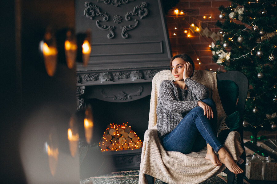 woman-sitting-chair-by-christmas-tree_fe617.jpg