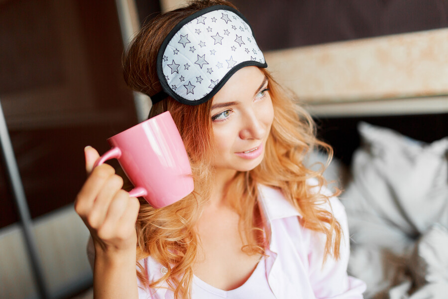 graceful-woman-with-candid-smile-posing-eye-mask-her-bedroom-drinking-hot-tea_8ceac.jpg