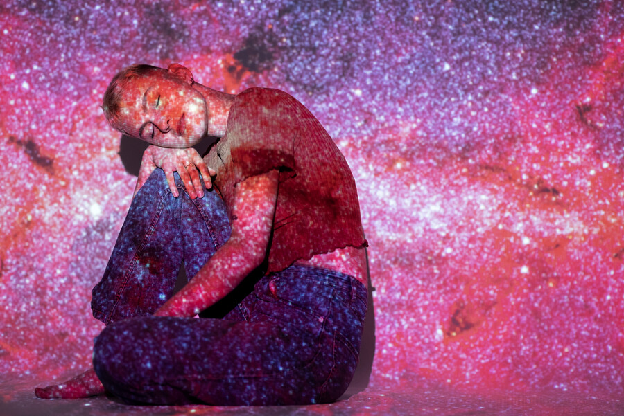 portrait-young-woman-posing-with-universe-projection-texture_c5ef4.jpg