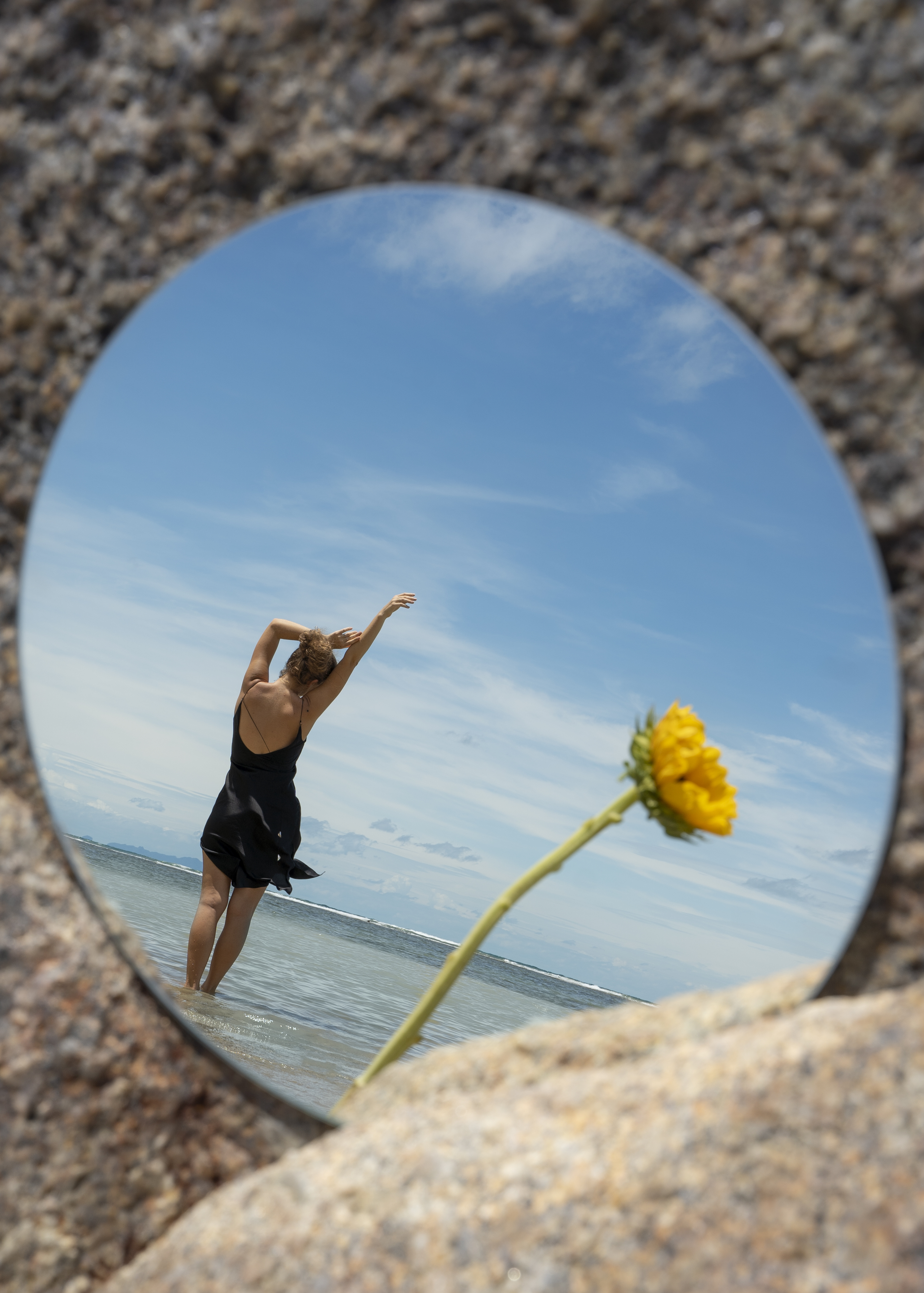 woman posing with round mirror flower 91f1b