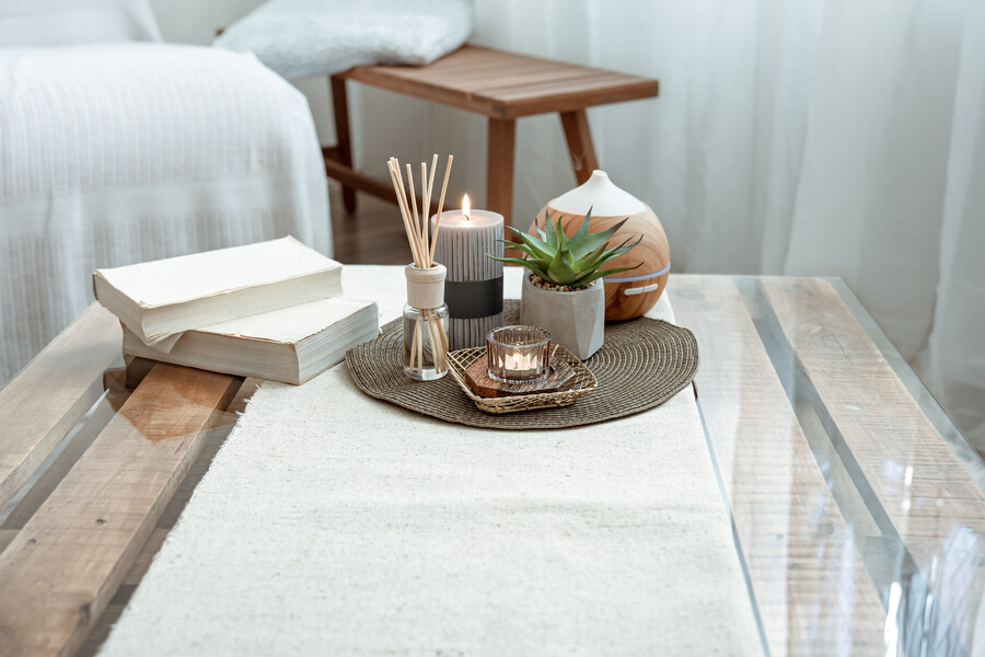 composition-with-incense-sticks-diffuser-candles-books-table-interior-room_1b351.jpg