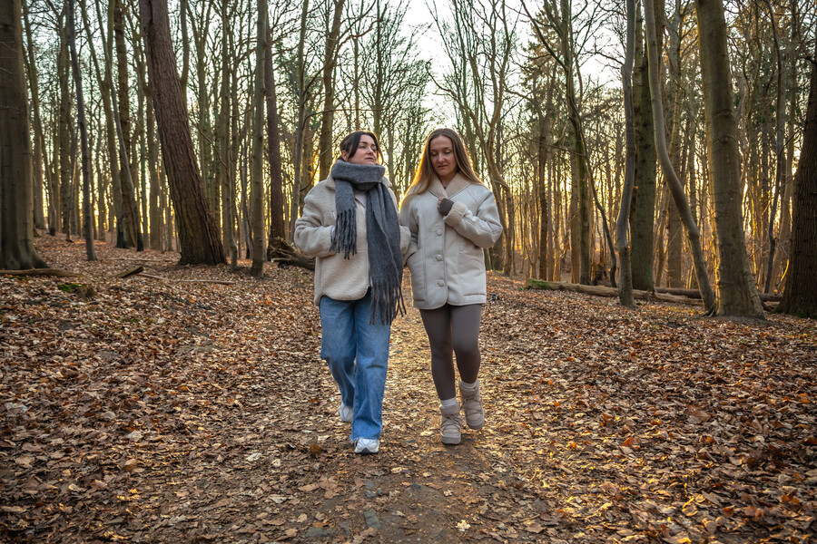 two-female-friends-walk-forest-friends-walking-through-forest-people-nature_8c54f.jpg
