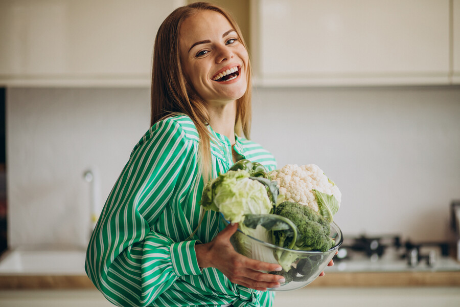 young-woman-smiling-holding-cauliflower_af06e.jpg