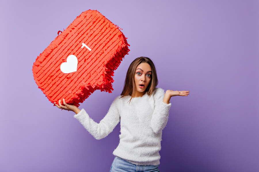 surprised-well-dressed-girl-posing-with-red-banner-indoor-portrait-emotional-female-blogger-fluffy-sweater_b5460.jpg