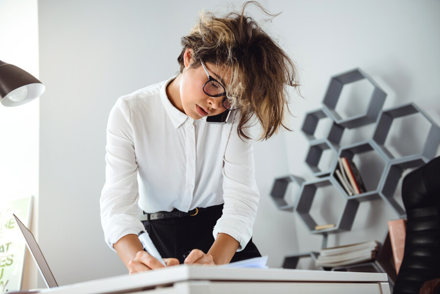 young-beautiful-businesswoman-with-messy-hair-speaking-phone-workplace-office_abafa.jpg