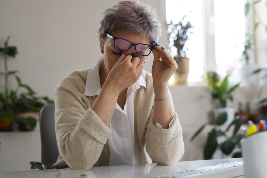 medium-shot-woman-sitting-desk_894f3.jpg