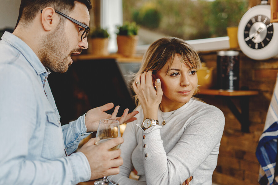 pensive-woman-looking-away-while-boyfriend-is-trying-talk-with-her-kitchen_9bf09.jpg