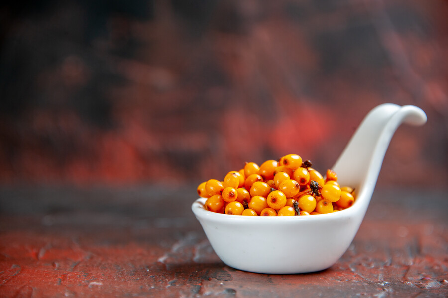 front-view-sea-buckthorn-white-bowl-dark-red-isolated-surface-free-space_c08d9.jpg