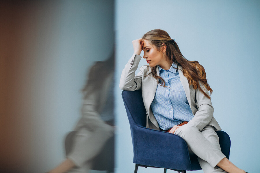 businesswoman-sitting-chair-office_24c4d.jpg