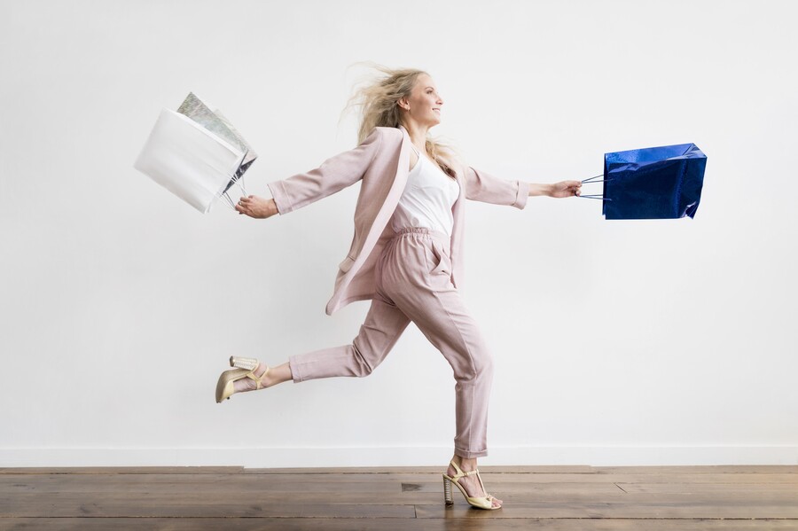 elegant-adult-woman-running-with-shopping-bags_c52b2.jpg