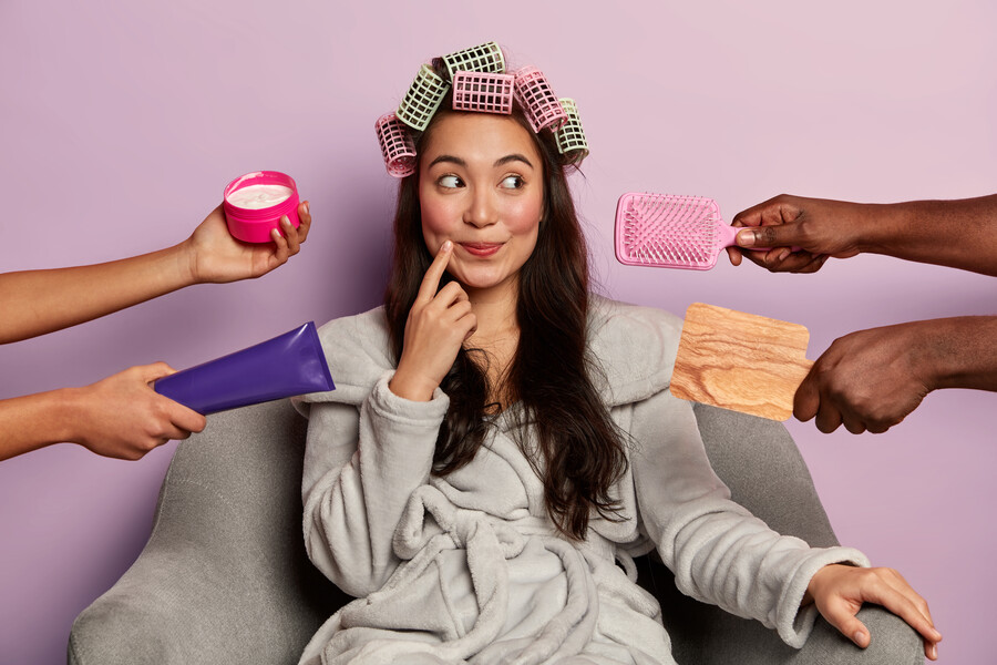 lovely-woman-with-pensive-dreamy-expression-wears-hair-curlers-bathrobe_9d2f0.jpg