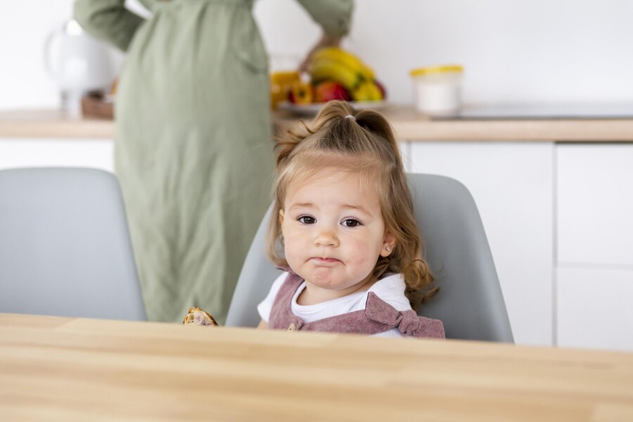 close-up-kid-sitting-chair_6faa8.jpg