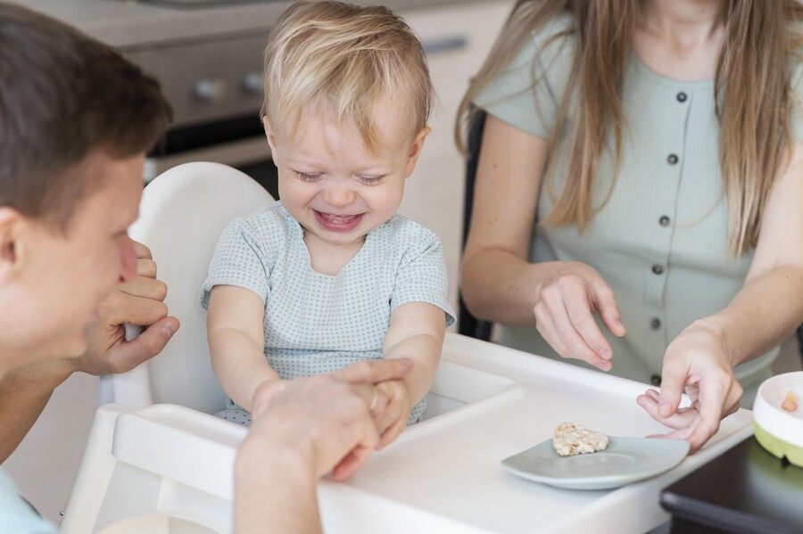 close-up-parents-feeding-toddler_4788a.jpg