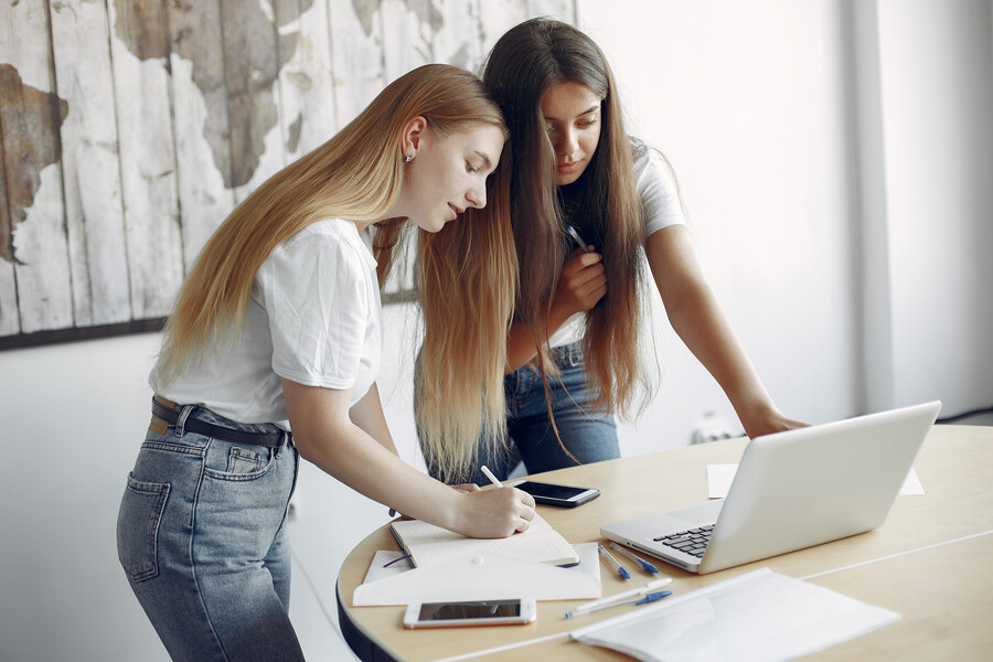 two-girls-white-t-shirts-working-office_d59cb.jpg