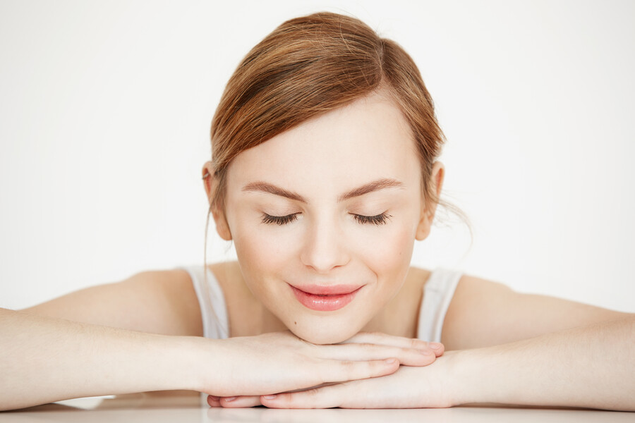 young-beautiful-girl-with-perfect-clean-skin-smiling-with-closed-eyes-sitting-table-beauty-spa-cosmetology_f49d8.jpg