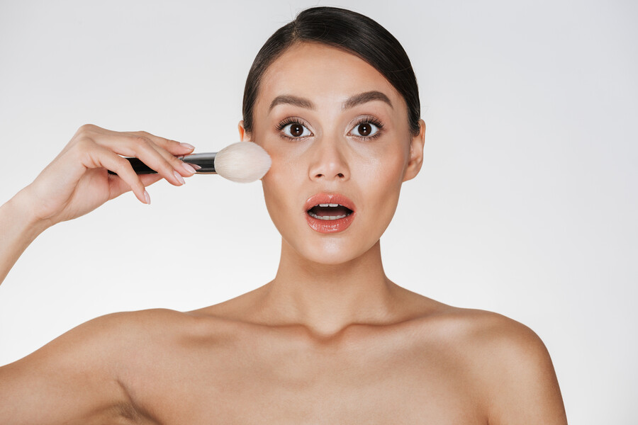 beauty-portrait-excited-woman-with-perfect-skin-looking-camera-applying-makeup-using-brush-isolated-white_fb58e.jpg
