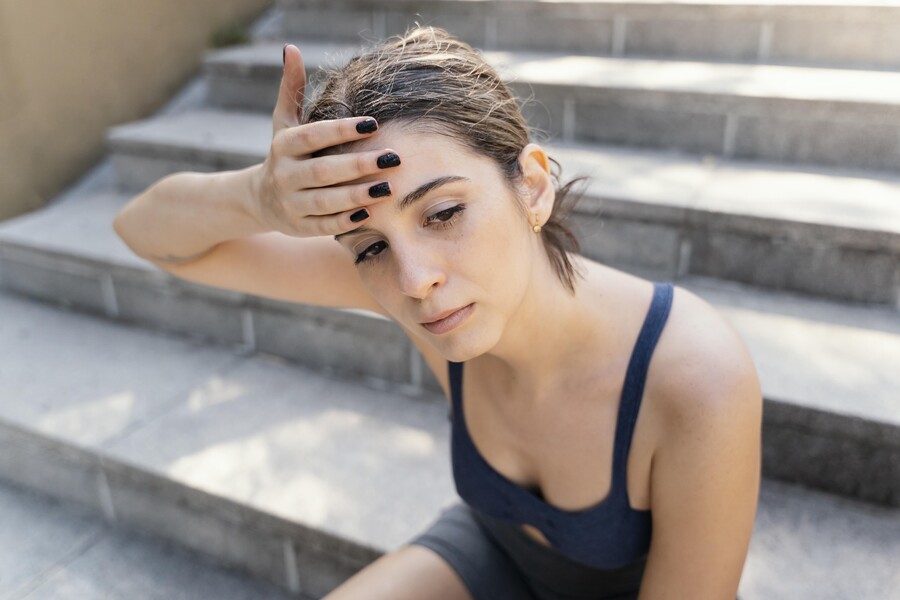 high-angle-exhausted-woman-resting-stairs-after-exercising_bdae1.jpg