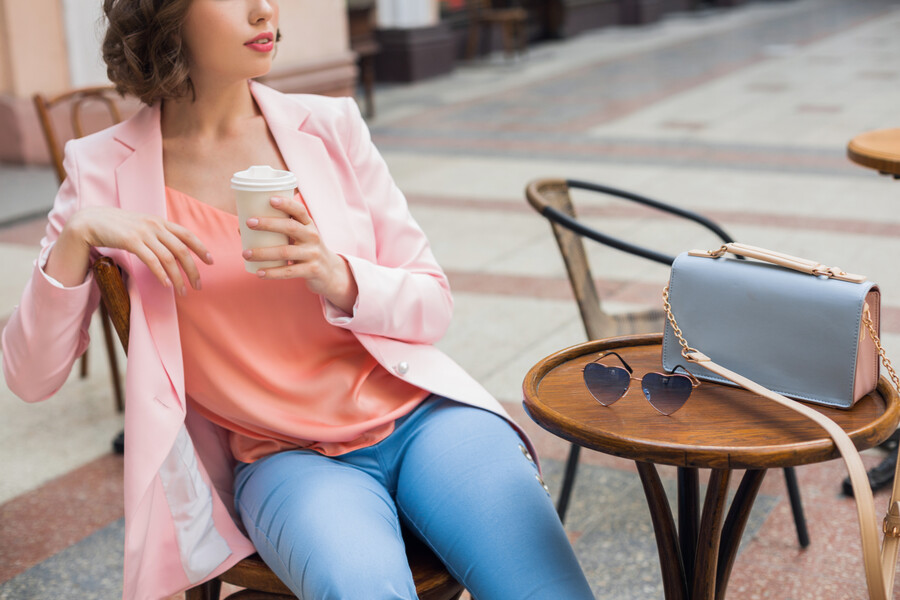 close-up-details-accessories-stylish-woman-sitting-cafe-drinking-coffee-sunglasses-handbag-spring-summer-fashion-trend-elegant-style_d2e39.jpg