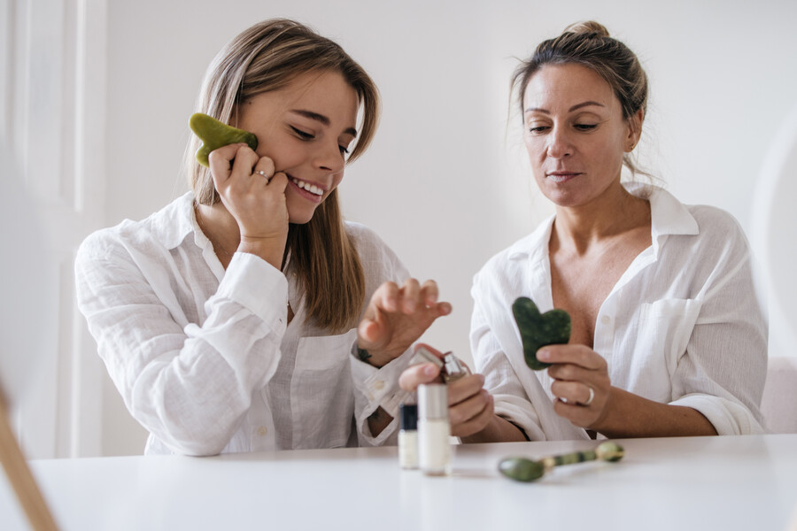 two-caucasian-blonde-women-different-ages-are-tasting-cosmetic-product-while-sitting-white-background-skin-care-hydration-concept_45cde.jpg