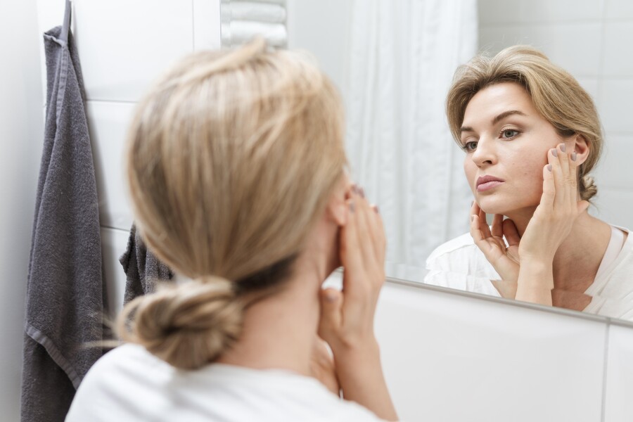woman-towel-checking-herself-mirror_394e1.jpg