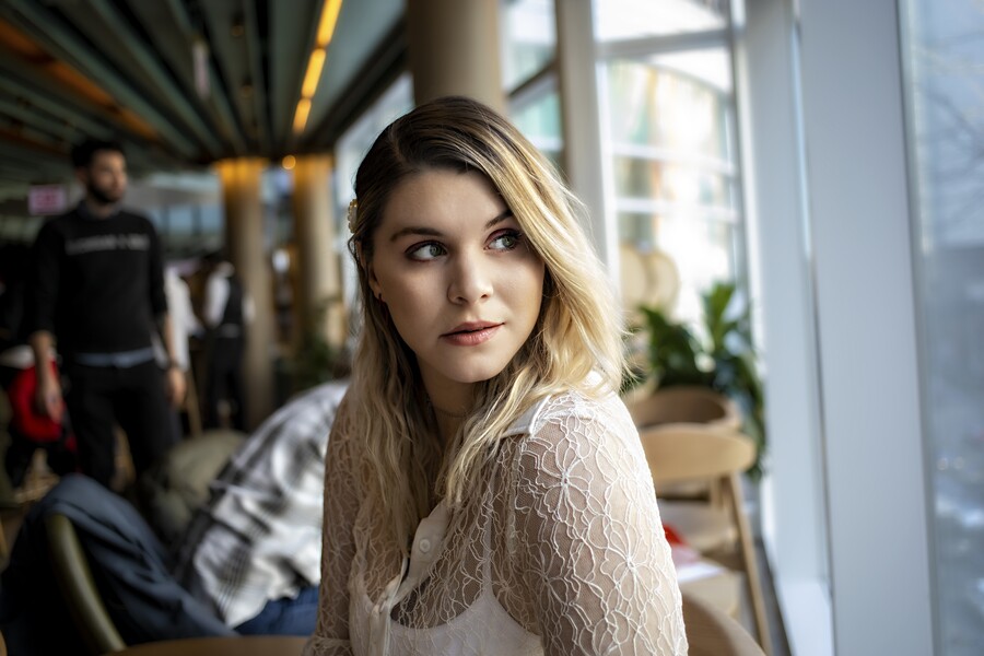 attractive-young-female-sitting-cafe-looking-outside-window_ef81361cdc685e32.jpg