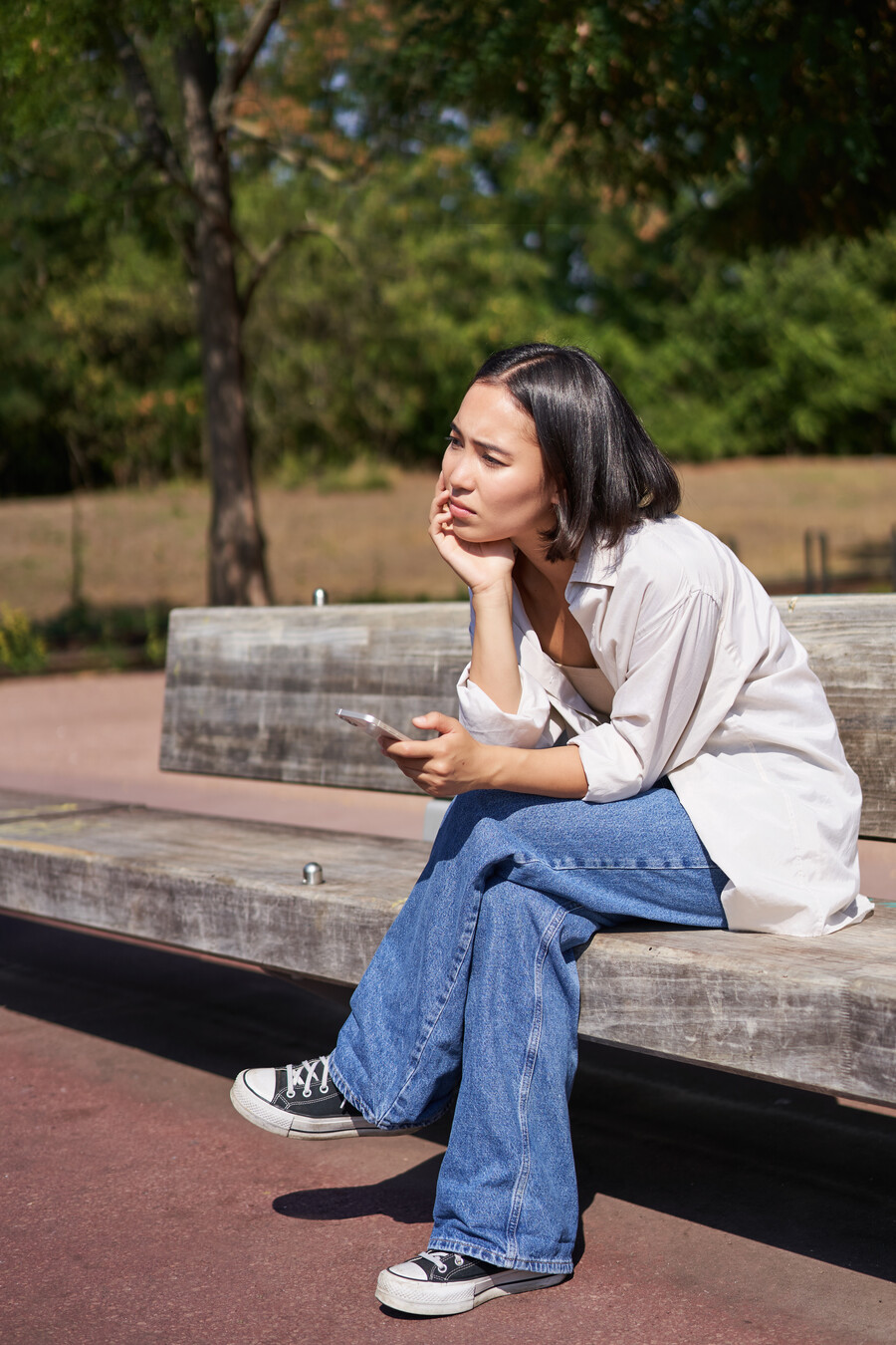 portrait-asian-girl-sitting-with-smartphone-feeling-sad-looking-gloomy-frustrated-waiting_2b1247a86aaebb78.jpg