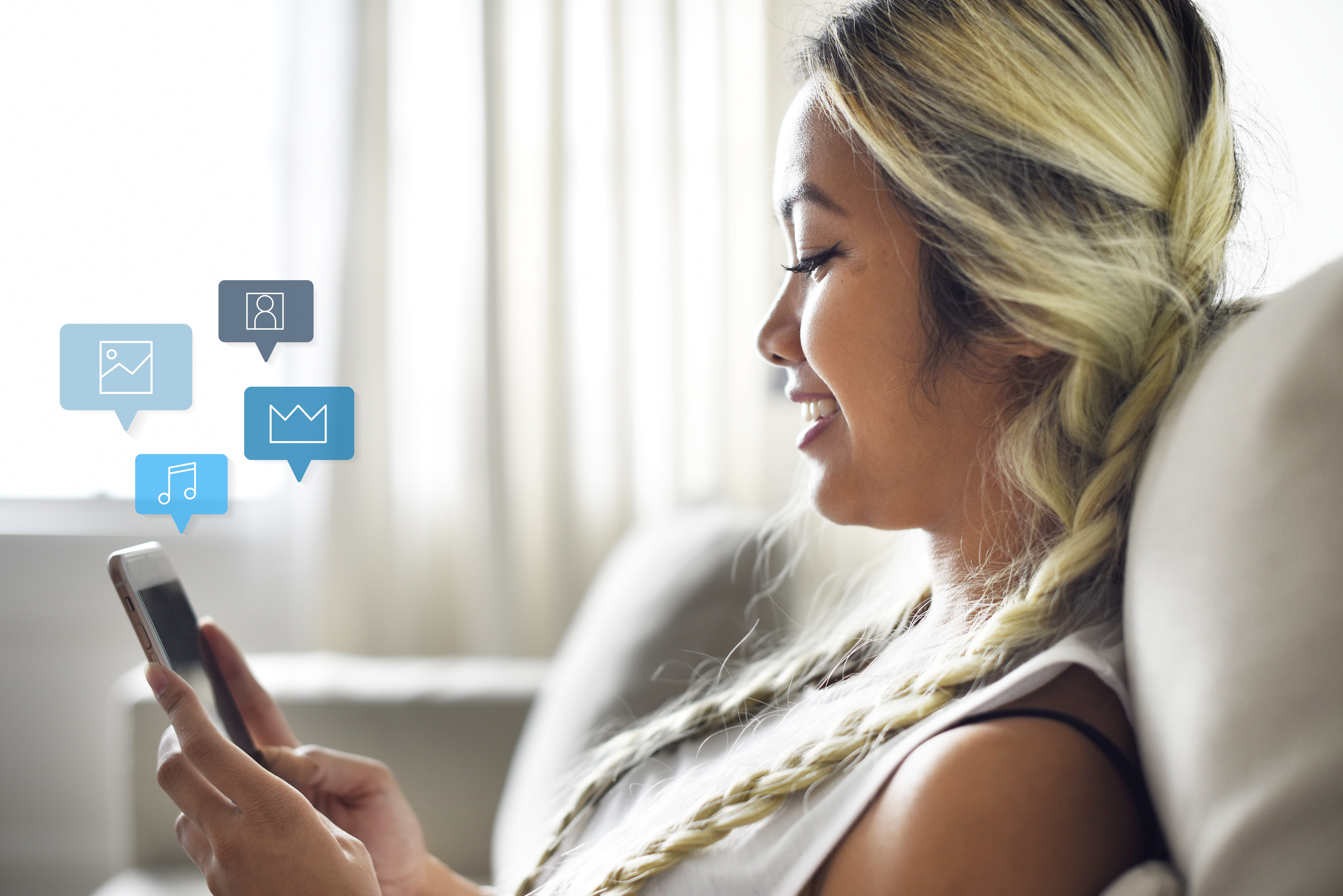 smiling woman using smartphone couch 35402760a9963a32