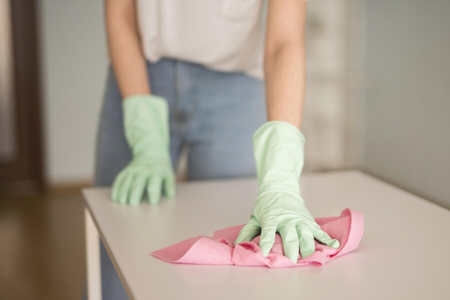 front-view-defocused-woman-cleaning-surface_3667b5a91cb16b3b.jpg